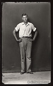 Man standing with arms on hips