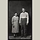 Older Couple, Man with Suspenders