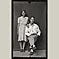 Man Seated with Wife in Polka Dot Dress