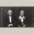 Elderly Couple in Black Suits